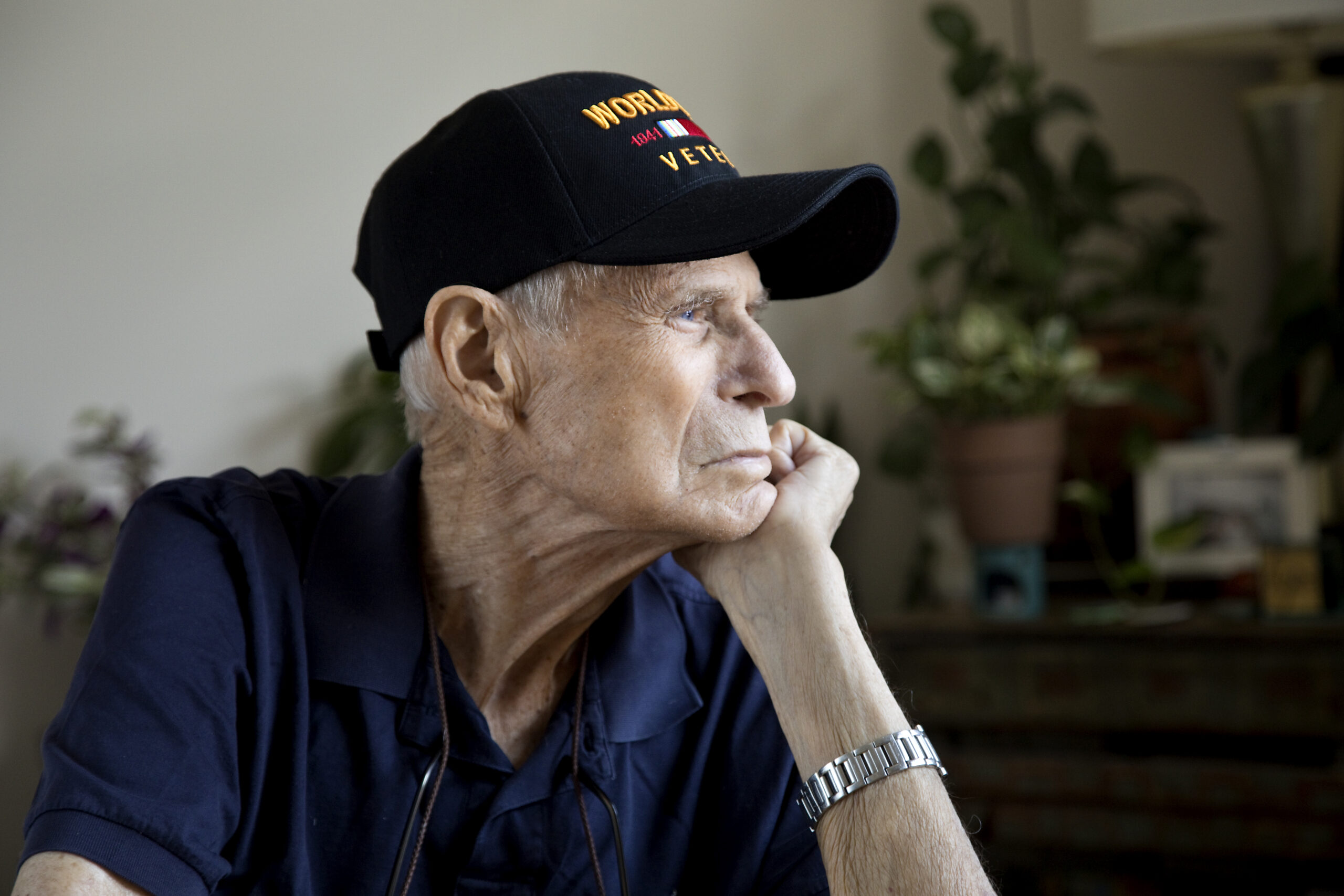 Elderly veteran wearing World War Two cap thinking about what’s next while approaching the end of life.