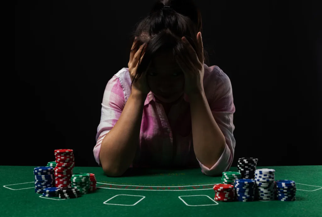 Sad woman sitting in casino.